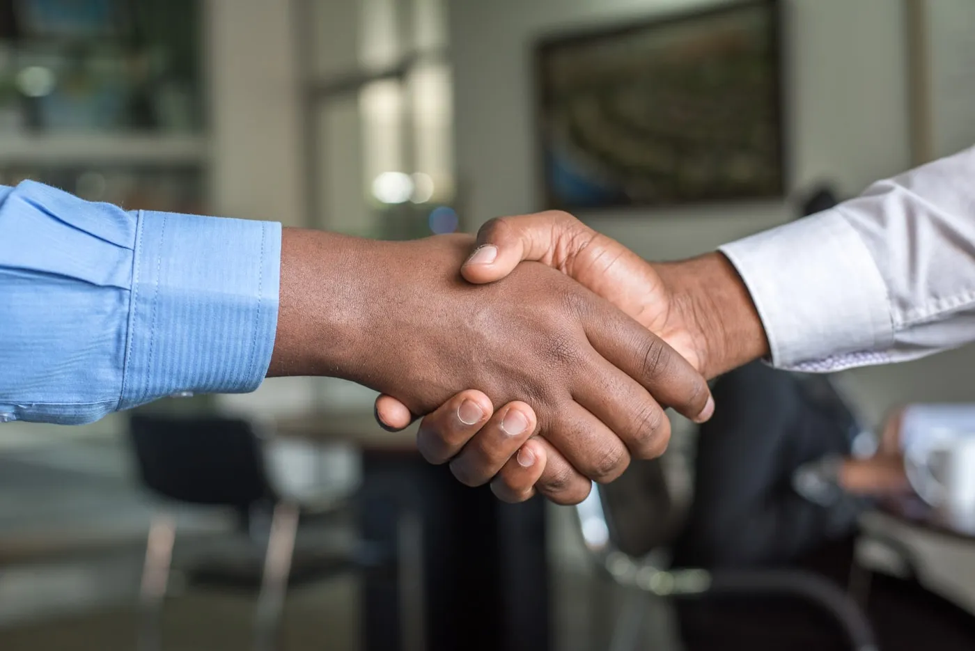 An adecs consultant shaking hands with a client